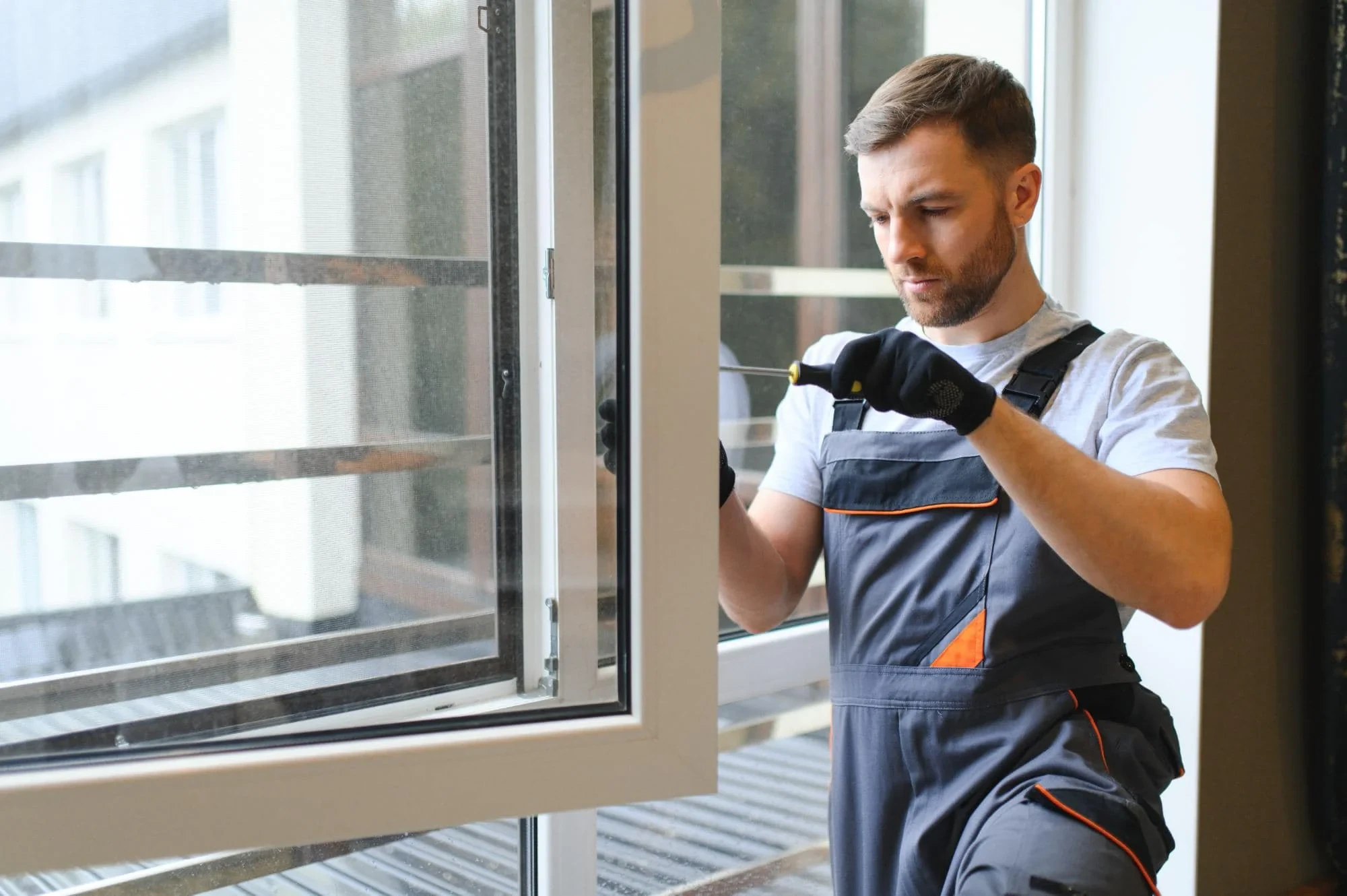 Man Repairing Window Pinellas County Florida