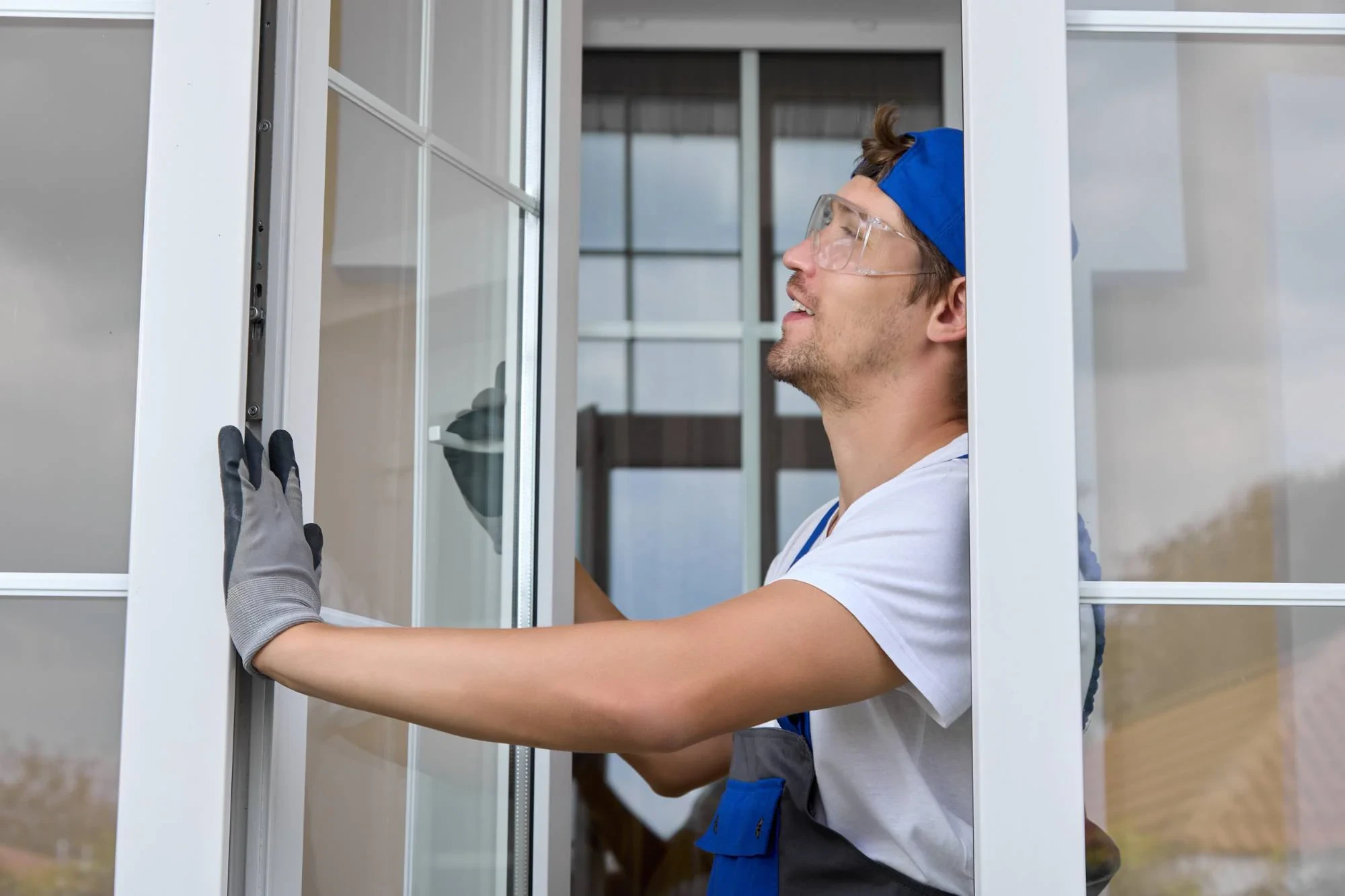 Worker Installing Glass Door Pinellas County Florida