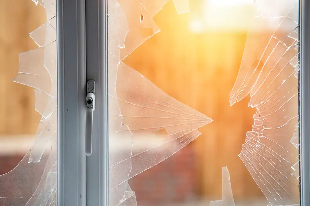 Shattered glass window with breakage, damaged door glass for repair or replacement, urgent glass repair service, safety glass replacement, easy-to-install glass solutions.